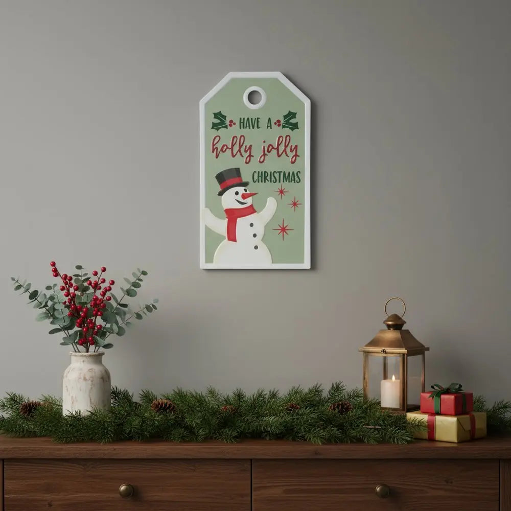16" X 9" Green And White Metal Christmas Snowman Hanging Wall Decor - NOBLE HOME INTERIORS