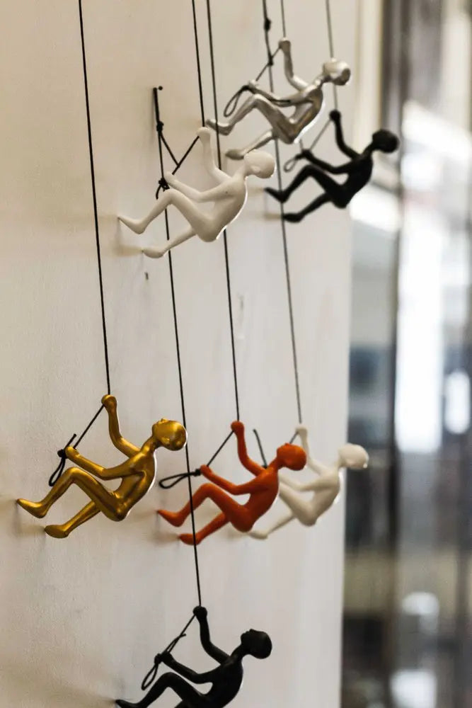 Set of Nine Rainbow Resin Climbing Man Hanging Dimensional Sculpture HomeRoots