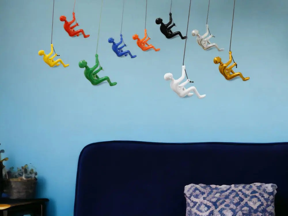 Set of Nine Rainbow Resin Climbing Man Hanging Dimensional Sculpture HomeRoots