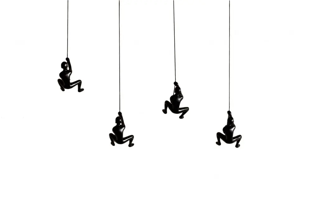 Set of Four Black Resin Climbing Man Hanging Dimensional Sculpture HomeRoots