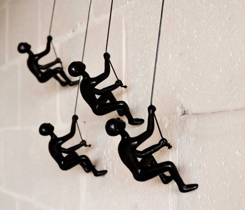 Set of Four Black Resin Climbing Man Hanging Dimensional Sculpture HomeRoots