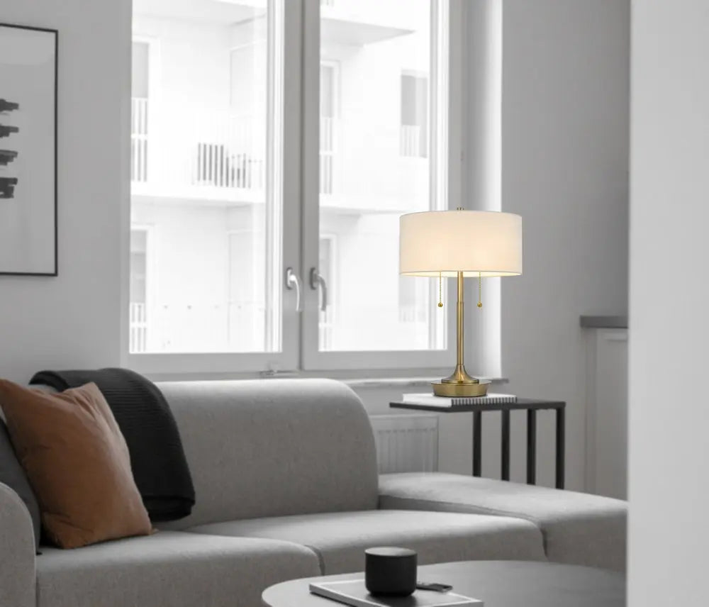 20" Antiqued Brass Metal Two Light Table Lamp With White Drum Shade HomeRoots