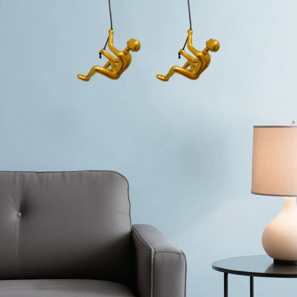 Set of Two Gold Resin Climbing Man Hanging Dimensional Sculpture HomeRoots