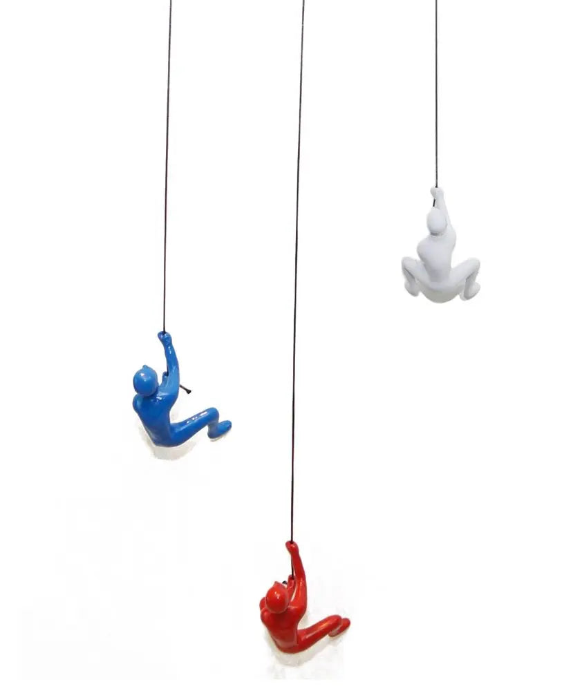 Set of Three Blue Red And White Resin Climbing Man Hanging Dimensional Sculpture HomeRoots