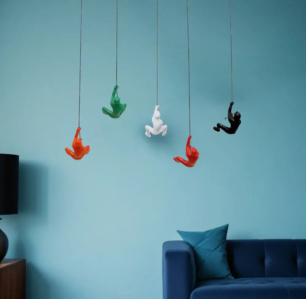 Set of Five Black Green Orange Red And White Resin Climbing Man Hanging Dimensional Sculpture HomeRoots