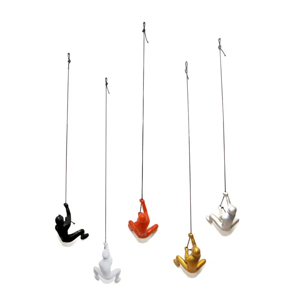 Set of Five Black Gold Orange Silver And White Resin Climbing Man Hanging Dimensional Sculpture HomeRoots