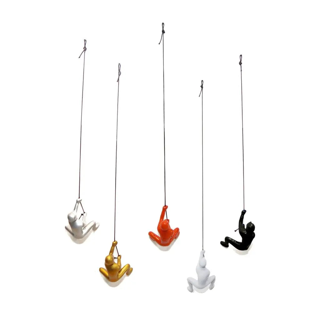 Set of Five Black Gold Orange Silver And White Resin Climbing Man Hanging Dimensional Sculpture HomeRoots