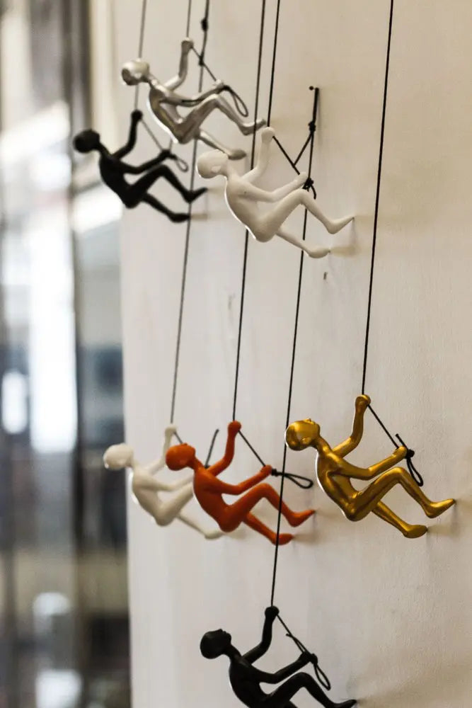 Set of Five Black Gold Orange Silver And White Resin Climbing Man Hanging Dimensional Sculpture HomeRoots