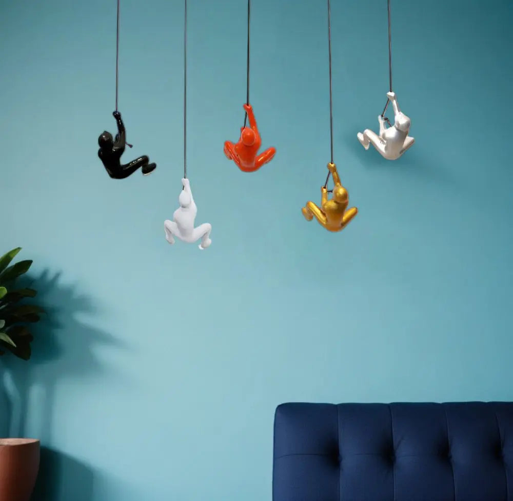 Set of Five Black Gold Orange Silver And White Resin Climbing Man Hanging Dimensional Sculpture HomeRoots