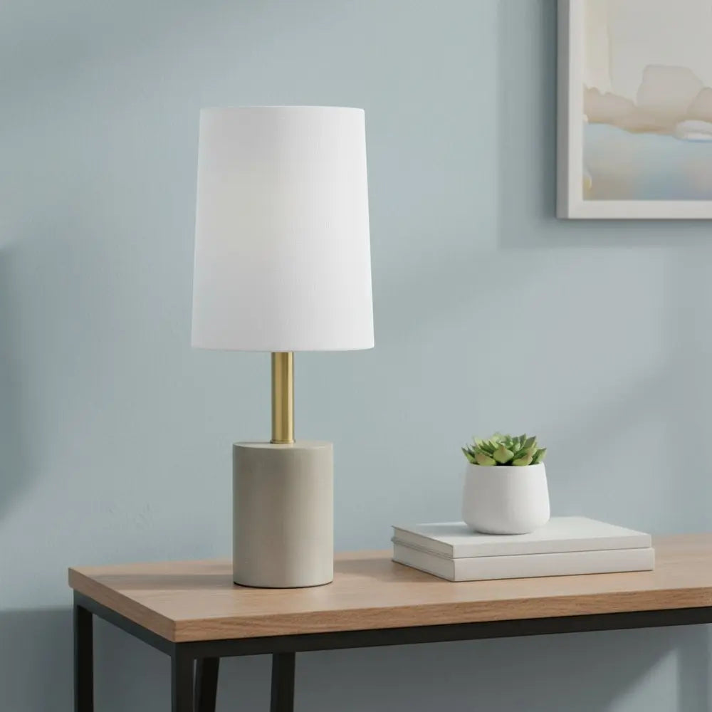 18" Gray And Antiqued Brass Concrete And Metal Table Lamp With White Drum Shade HomeRoots