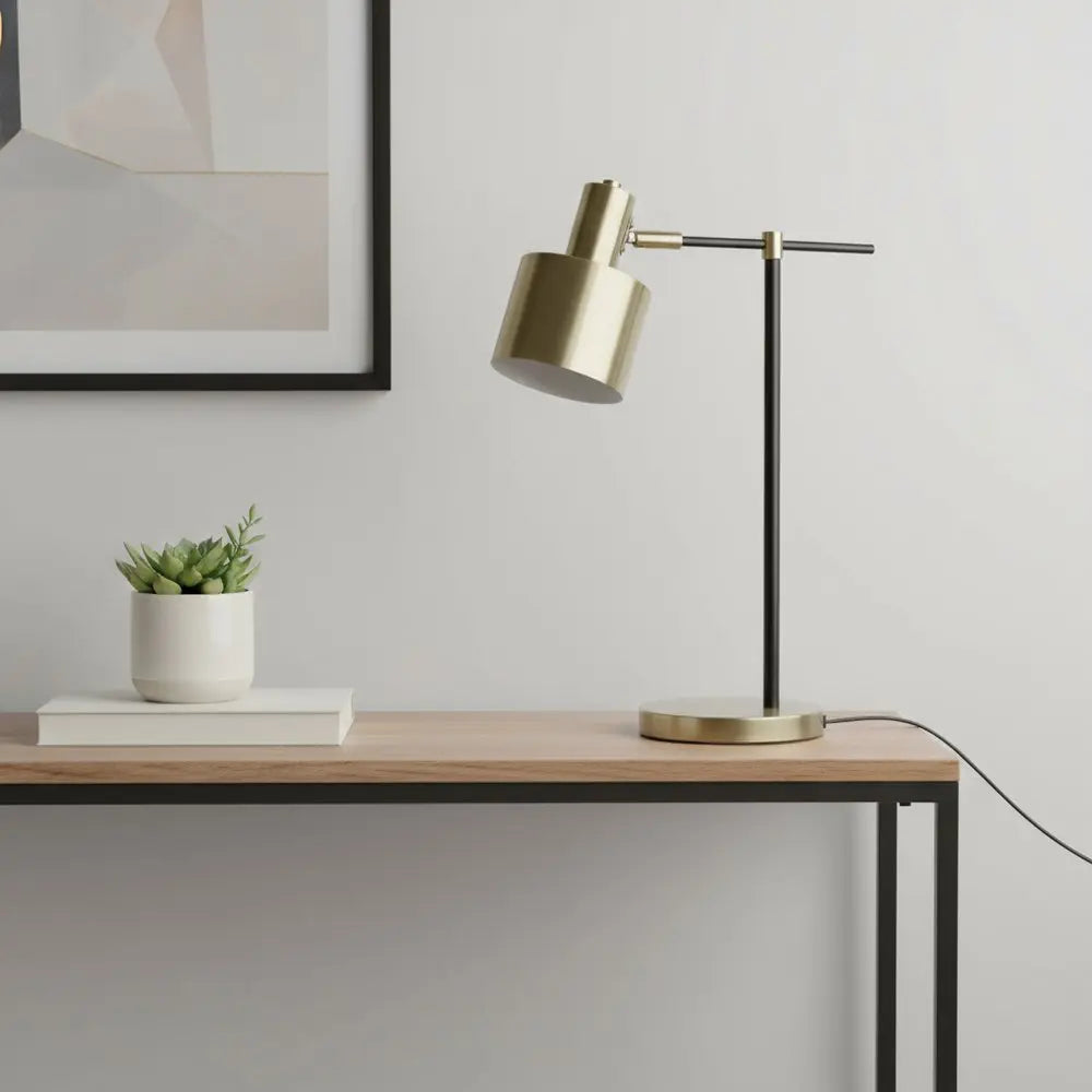 22" Antiqued Brass And Black Metal Table Lamp With Antiqued Brass Globe Shade HomeRoots