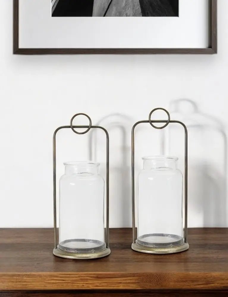 Set of Two Bronze Metal And Glass Tabletop Hurricane Candle Holders HomeRoots