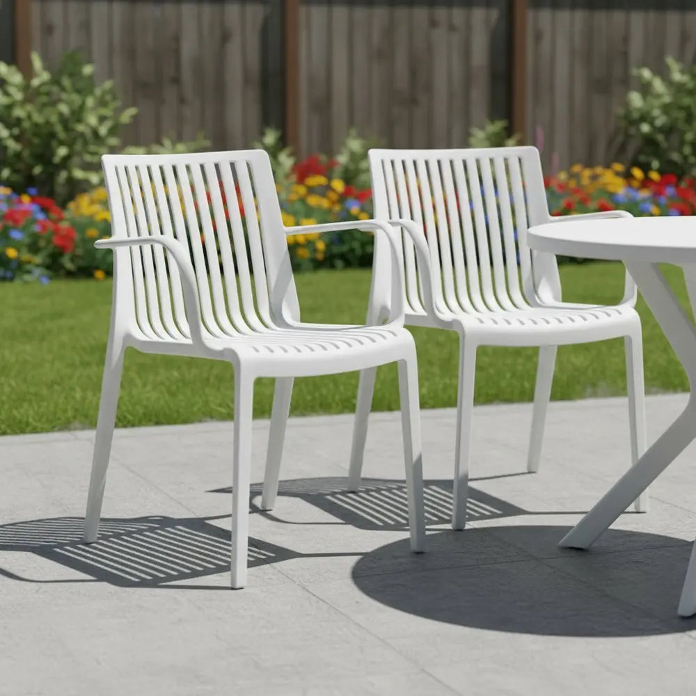 Set of Two White Heavy Duty Plastic Outdoor Stacking Arm Chairs - NOBLE HOME INTERIORS